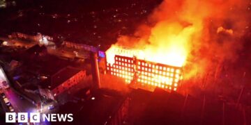Arrest after major fire tears through historic mill