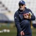 Darren Lehmann prepares to catch a cricket ball while wearing a baseball mitt