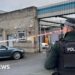 Delivery driver threatened at gunpoint in attack on police station