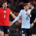 Harry Maguire of England and Federico Valverde of Uruguay react towards referee Sven Jablonski