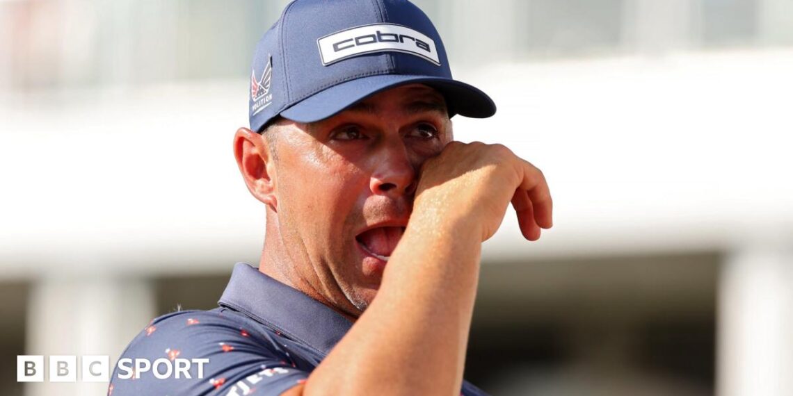 American golfer Gary Woodland cries as he embraces his wife Gabby after winning the Houston Open