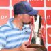 Alex Fitzpatrick kisses the Indian Open trophy