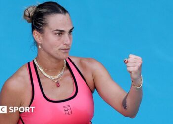 Aryna Sabalenka celebrates winning a point with a clenched fist
