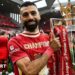 Mohamed Salah poses with the Premier League trophy