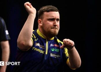 Luke Littler celebrates a 170 checkout