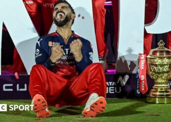 An England player behind a question mark