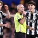 Tino Livramento of Newcastle United and Anthony Gordon of Newcastle United complain to match referee Paul Tierney