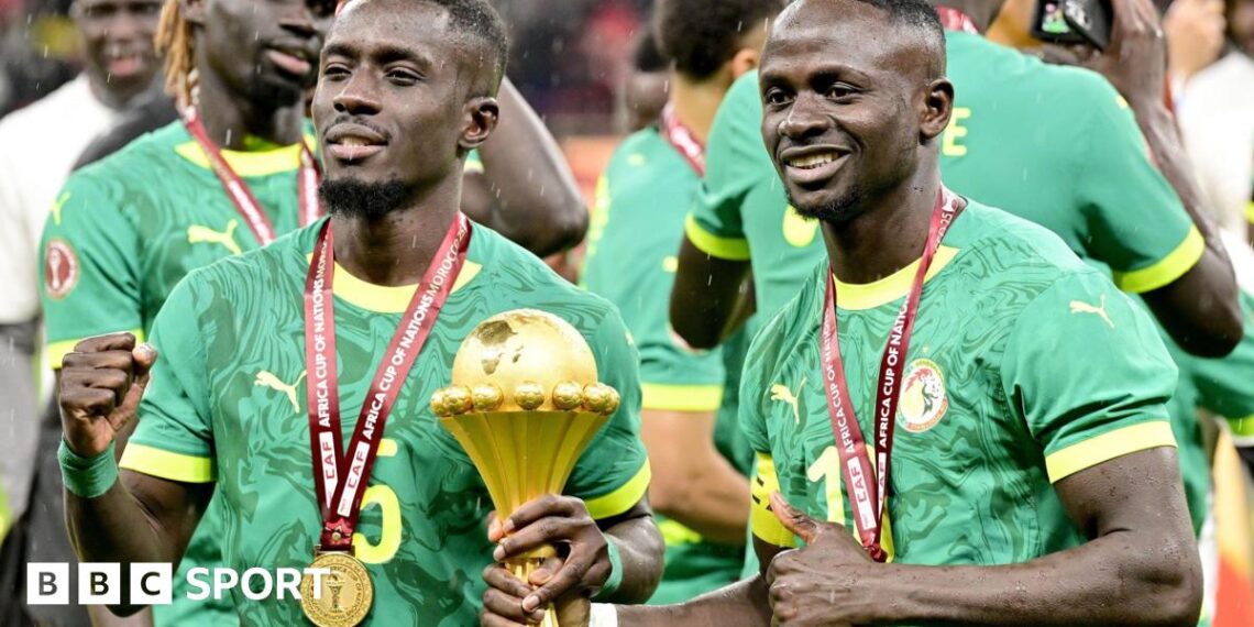 Senegal players celebrate with the Africa Cup of Nations title