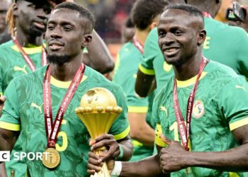 Senegal players celebrate with the Africa Cup of Nations title