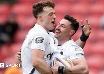 Bath's Bernard van der Linde hugs team-mate Louie Hennessey in celebration
