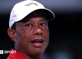 Tiger Woods looks on