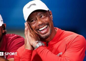 Tiger Woods celebrates