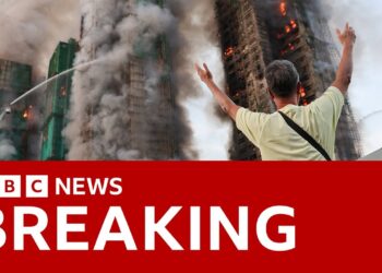 At least four killed as fire engulfs Hong Kong apartment blocks | BBC News