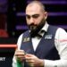 Hossein Vafaei chalking his cue
