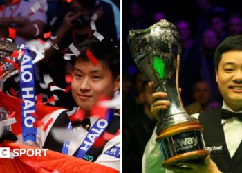 Zhao Xintong (left) with the World Championship trophy and Ding Junhui with the UK Championship trophy