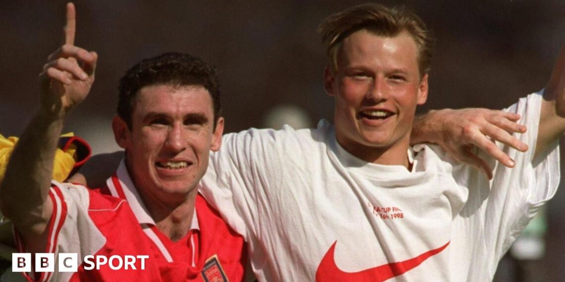 Martin Keown (left) and Alex Manninger celebrate together at Wembley after Arsenal's FA Cup final win over Newcastle in 1998