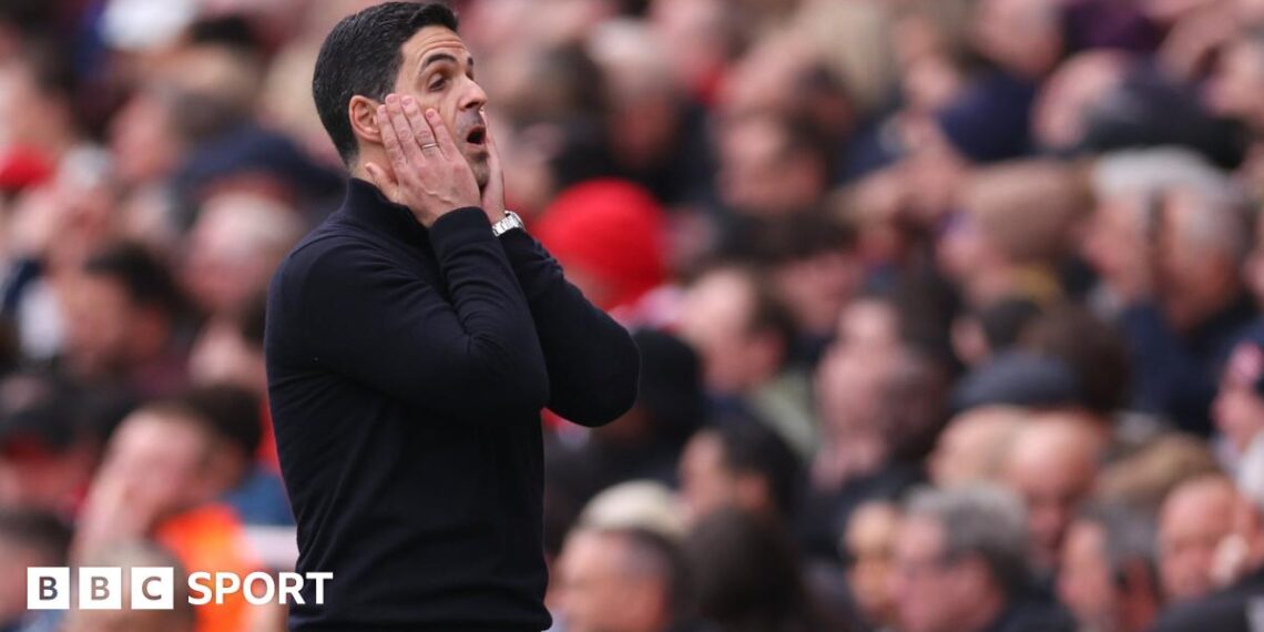 Declan Rice with his hands on his head.