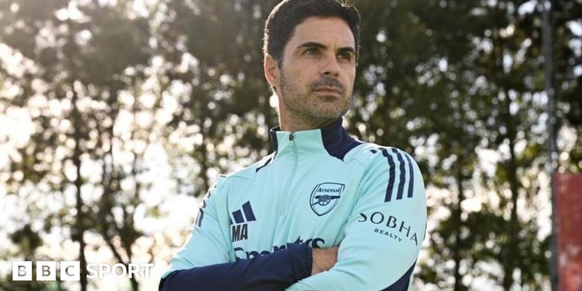 Arsenal manager Mikel Arteta poses with arms folded