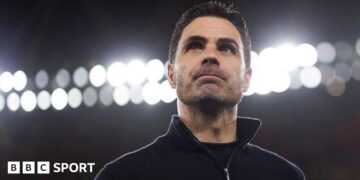 Mikel Arteta with lights behind him