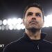 Mikel Arteta with lights behind him