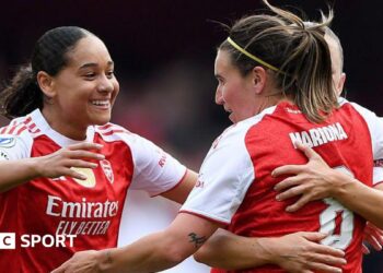 Olivia Smith nicks ball away from Lyon goalkeeper Christiane Endler