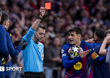 Referee Clement Turpin sends off Eric Garcia during Barcelona's Champions League second leg against Atletico Madrid in 2026 while his team-mate Pedri protests