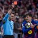 Referee Clement Turpin sends off Eric Garcia during Barcelona's Champions League second leg against Atletico Madrid in 2026 while his team-mate Pedri protests