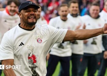 Bayern Munich players line up to celebrate winning the Bundesliga title