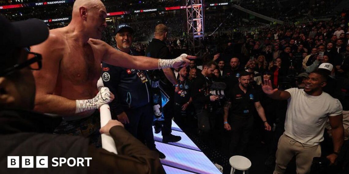Anthony Joshua throws a left hook against Jake Paul