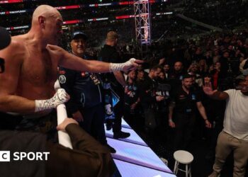 Anthony Joshua throws a left hook against Jake Paul
