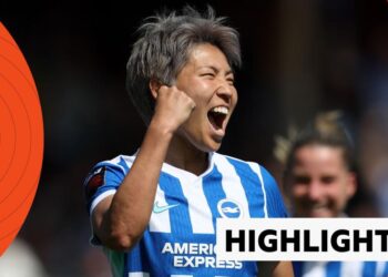 Brighton's Kiko Seike celebrates with one fist up in the air