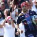 Louis Bielle-Biarrey with the ball in his left hand while wearing Bordeaux's dark and light blue striped shirt in match action