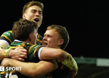 Northampton players celebrate a try