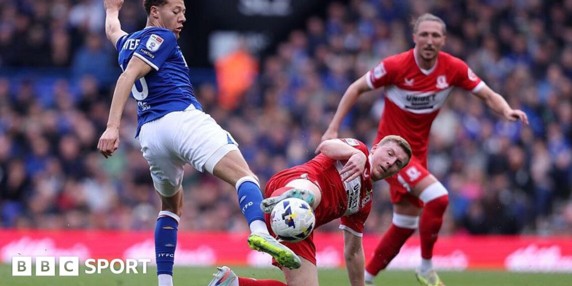 Kasey McAteer of Ipswich Town and Dael Fry of Middlesbrough challenge for a loose ball
