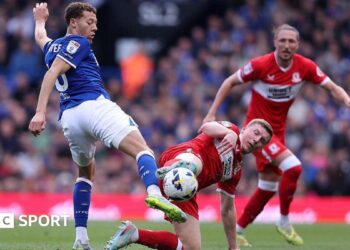 Kasey McAteer of Ipswich Town and Dael Fry of Middlesbrough challenge for a loose ball