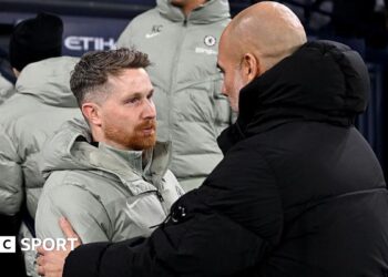 Calum McFarlane embraces Pep Guardiola after drawing at Manchester City earlier in the season