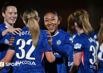 Chelsea women's players celebrate a goal