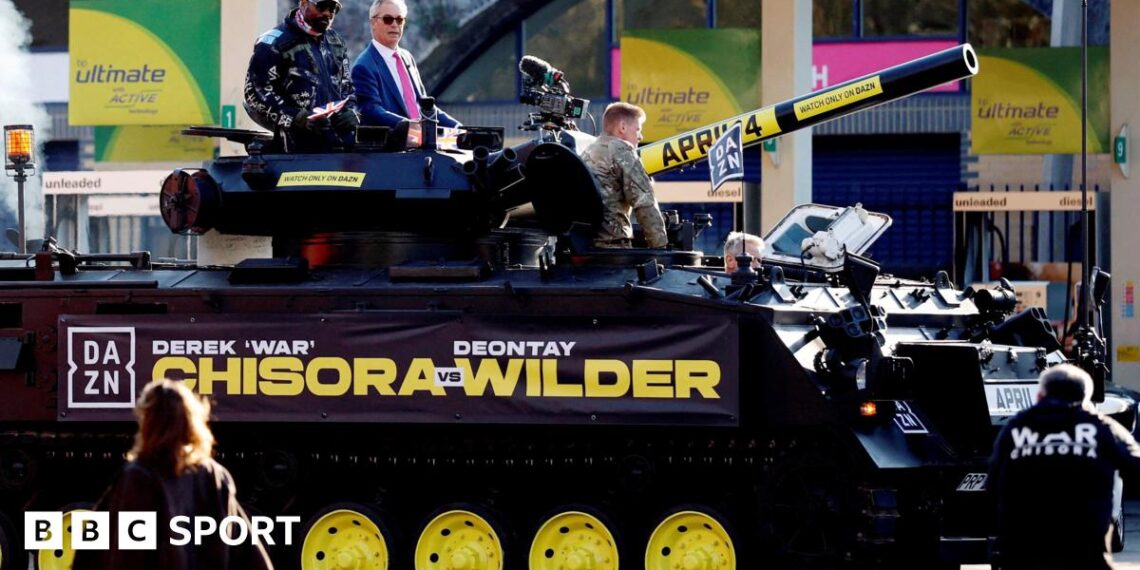 Derek Chisora and Nigel Farage on a tank