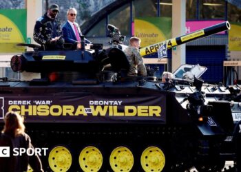 Derek Chisora and Nigel Farage on a tank