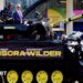 Derek Chisora and Nigel Farage on a tank