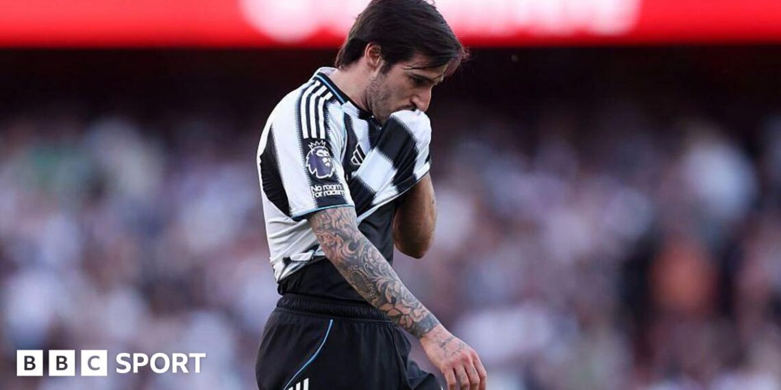 Newcastle's Sandro Tonali wipes his face with his shirt