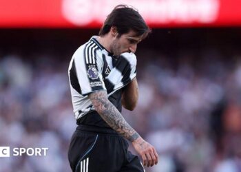 Newcastle's Sandro Tonali wipes his face with his shirt