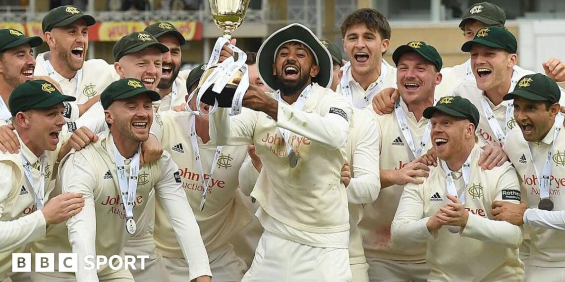 Haseeb Hameed lifts the County Championship trophy at Trent Bridge