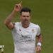 Sir James Anderson takes a wicket and celebrates with his right hand in the air
