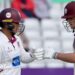 Josh Thomas and Archie Vaughan bump fists