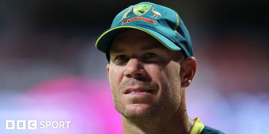David Warner wearing an Australia cap