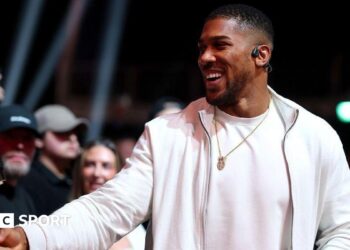 British boxer Anthony Joshua shakes hands at the fight between Deontay Wilder and Derek Chisora
