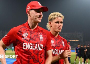 Harry Brook and Jacob Bethell leave the field after the T20 World Cup match between England and Bangladesh