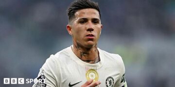 Enzo Fernandez wearing a white Chelsea shirt
