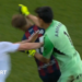 Real Zaragoza goalkeeper Esteban Andrada punches Huesca captain Jorge Pulido